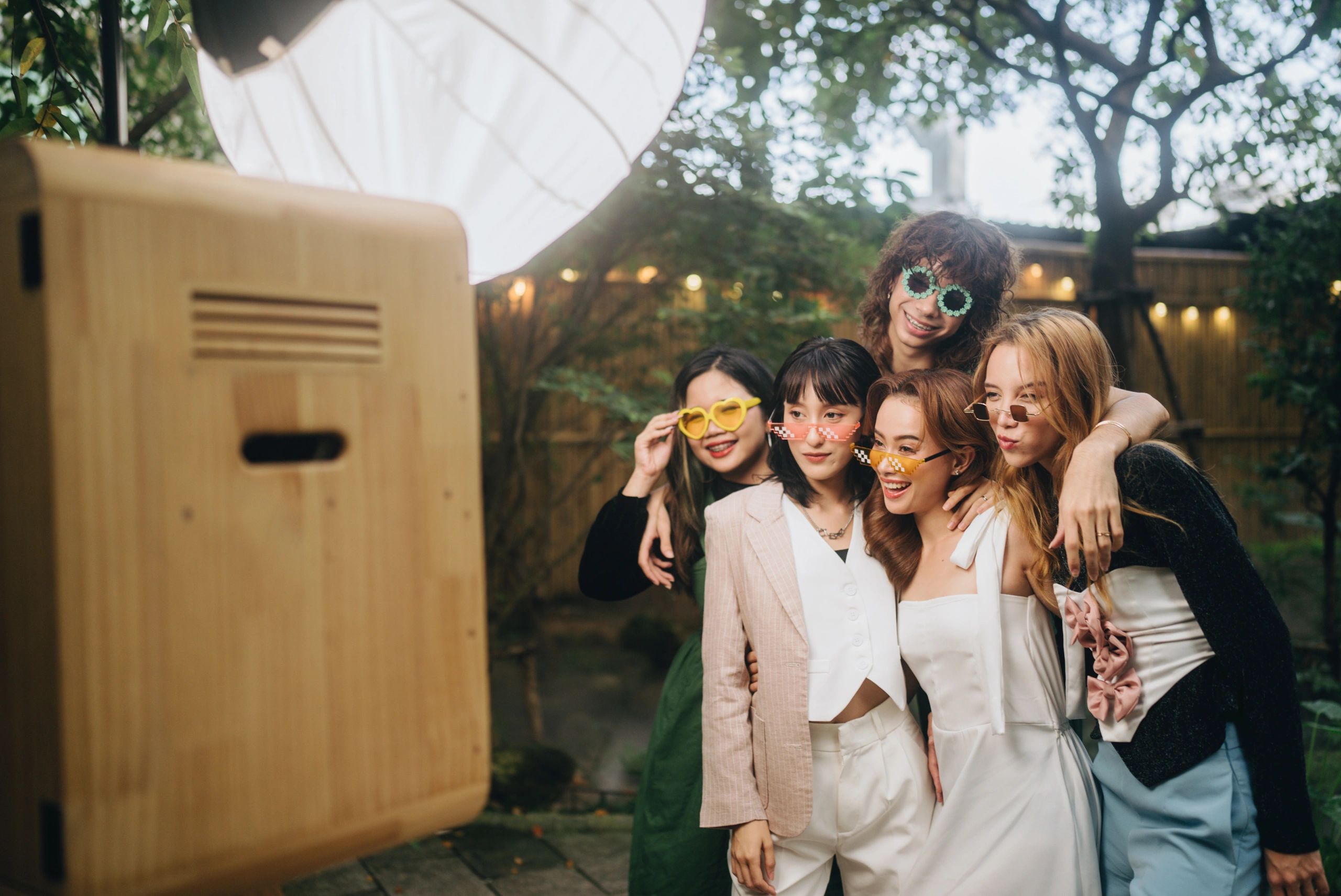Happy bride using a photobooth